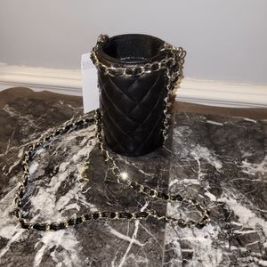Whitehouse Blackmarket faux leather water bottle carrier with chain.